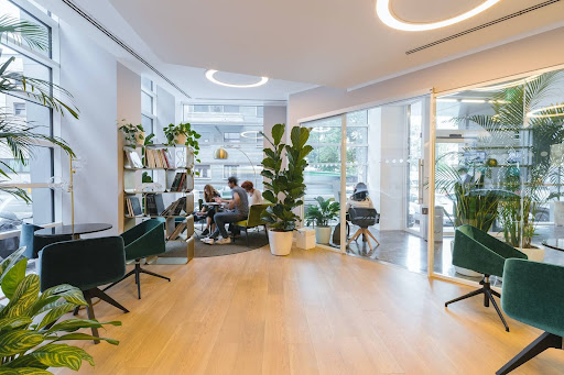 Modern office furniture and modular desks are used at an office to enhance workspace