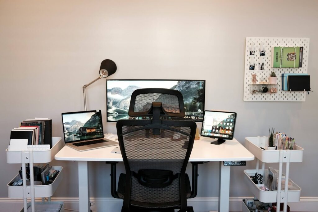 A workstation desk can accommodate multiple electronic devices